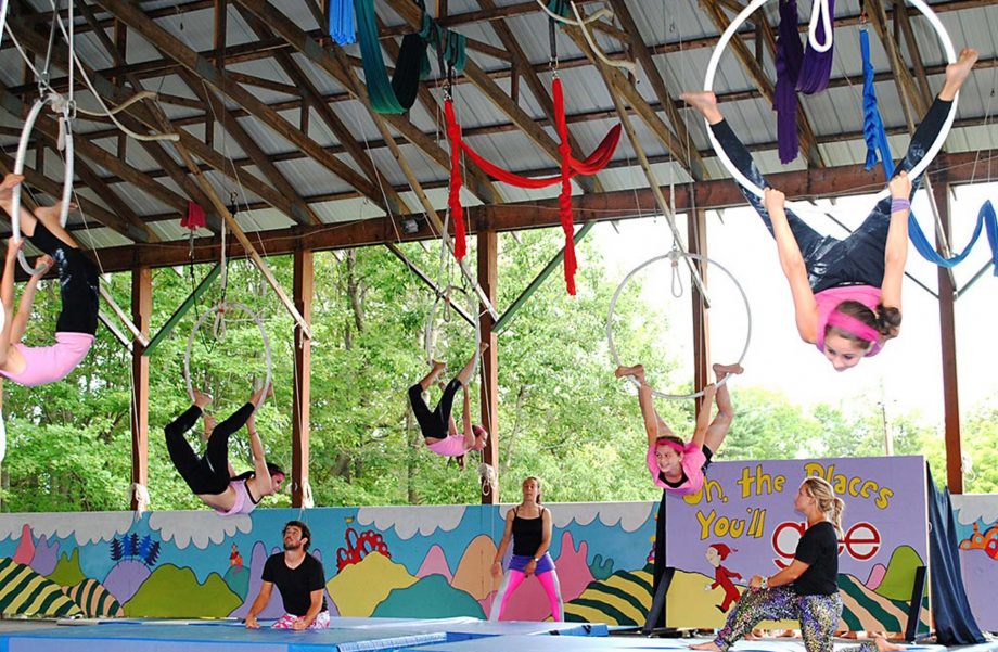 Campers on trapeze rings